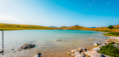 Deep blue waters of Vrazje Jezero (Devil's Lake) on the high plateau of Durmitor National Park, scenic mountain lake landscape in Montenegro.
