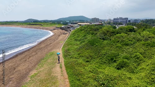 Aerial drone view of Gwangchigi Beach and Seongsan Ilchulbong coastline in Jeju Island South Korea