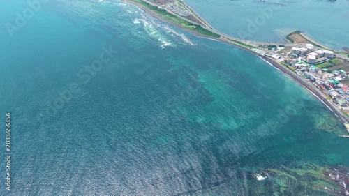 Aerial drone view of Gwangchigi Beach and Seongsan Ilchulbong coastline in Jeju Island South Korea