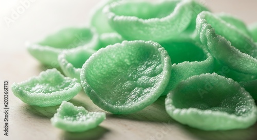 A Close-Up View of Light Green Round Crispy Snacks.