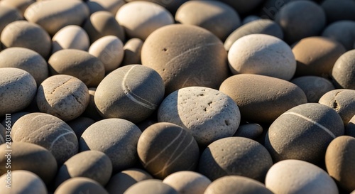 Close-up of Smooth Rounded Beach Pebbles with Natural Striping.