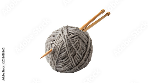 Fotografija Small ball of grey woolen yarn with two metallic knitting needles for winter cra