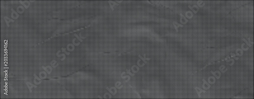 Close-up of a dark grey textured fabric with wrinkles on a flat surface