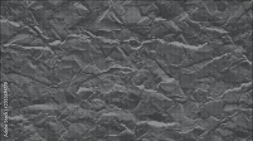 A close-up view of a crumpled gray surface with many wrinkles and creases.
