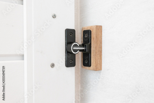 Obraz na plátne The bathroom sliding door latch is locked.