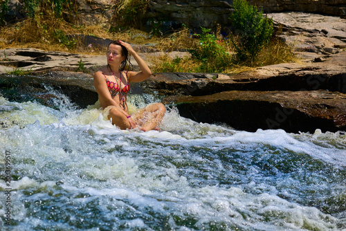 Obraz na płótnie Cute woman in swimwearin mountain river.Relax and resting