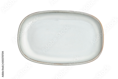 White ceramic oval plate isolated on transparent background. Empty dish for food presentation. Minimalist tableware for dining table setting. Modern kitchenware design for restaurant serving.