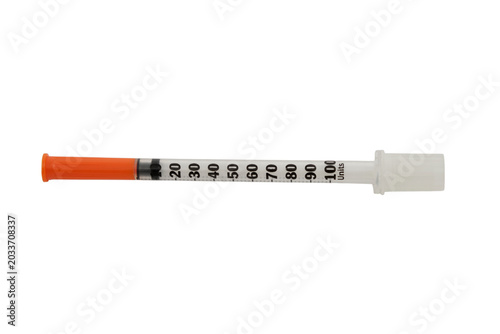 Insulin syringe with orange cap on transparent background. Medical device for subcutaneous injection of medication. Tool for diabetes management and glucose level control in medical treatment.