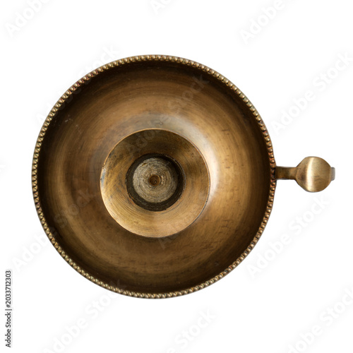 Antique brass candlestick holder on isolated transparent background. Top view of aged metal candle stand for home decor, interior design, vintage lighting and ritual ceremony lighting equipment.