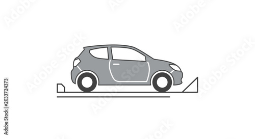 Small hatchback car on lift.