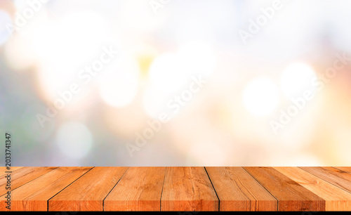 perspective wooden board over bright abstract background