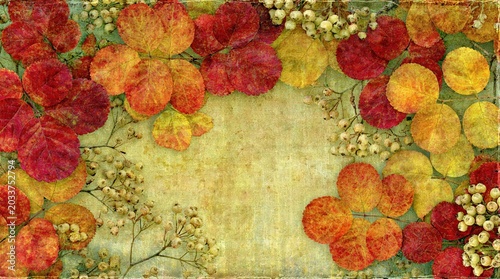 Autumn leaves frame on vintage textured background