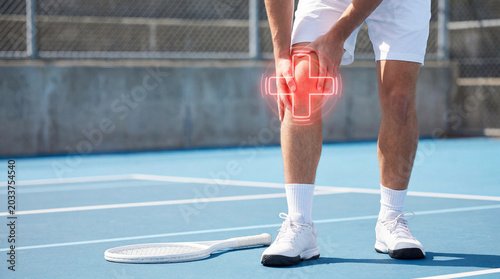 Male tennis player standing on blue outdoor court holding knee with glowing red digital cross overlay, athletic joint injury, sports trauma pain.