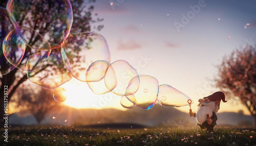Whimsical gnome blowing giant iridescent bubbles at golden sunset in enchanted spring meadow with blooming trees and magical atmosphere