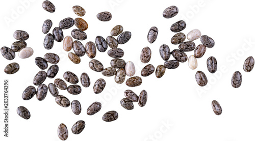 Top view of scattered macro chia seeds on white background