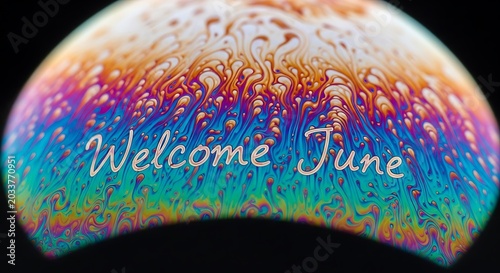 Colorful welcome sign with confetti and rainbow gradient.
