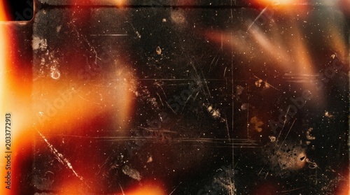 vintage film light leak overlay texture, gritty dust, scratches, grain and faded analog glow for retro photo effect, poster backdrop or distressed design, widescreen composition, moody contrast,