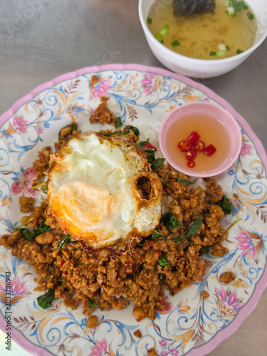 Rice topped with stir-fried pork and basil, Rice topped with stir fried minced pork and basil with Fried egg