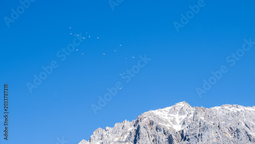 Paragliders near Ramsau in Austria above the Dachstein glacier in summer