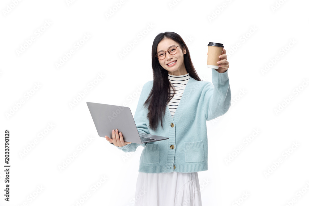 Naklejka premium Smiling Young Woman Holding Laptop and Takeaway Coffee