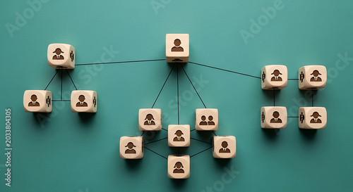 Wooden cubes with people forming organizational chart