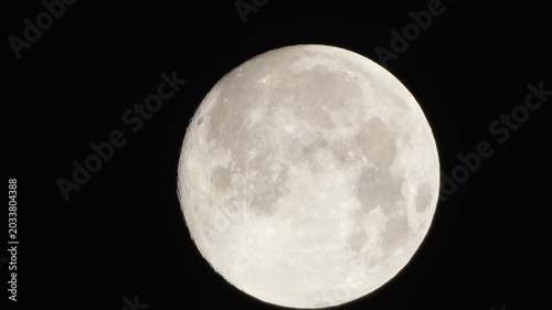 Moon night space close up view of a glowing full moon shining brightly in the dark clear night sky