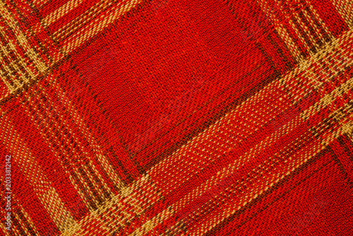 Tableau sur toile Red and tan plaid woven textile texture for background Close up of red woven fab