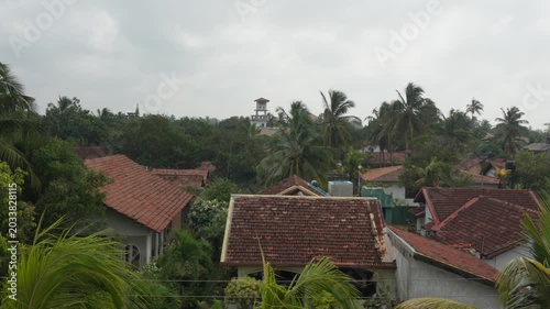 View of old tiled roofs and lush tropical greenery from the hotel in the historic Christian part of Negombo