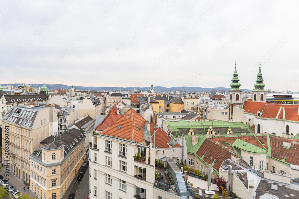 Obraz premium Vienna cityscape panorama with historic red rooftops and urban skyline view