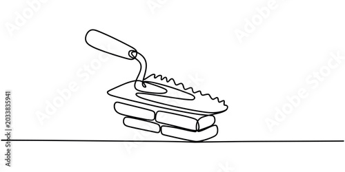Tableau sur toile Cement trowel on bricks masonry tool construction tool bricklaying continuous on