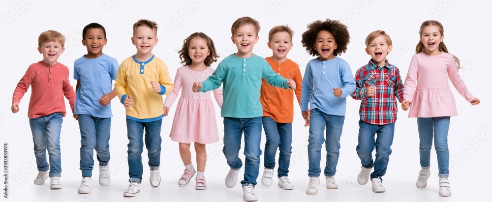 Fototapeta premium Energetic diverse kids playing and laughing together in a bright, cheerful studio setting promoting active lifestyle.