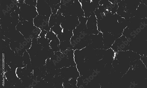 Close-up black marble texture with irregular white vein-like cracks, high-contrast natural stone pattern for design, architecture, geology, or artistic background use