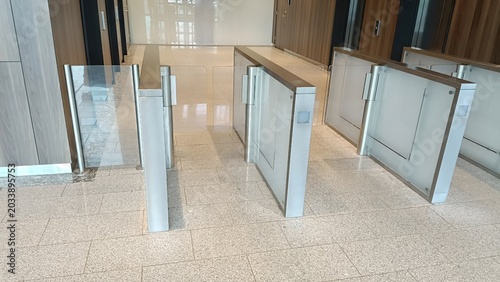 Cuadro en lienzo Modern glass turnstiles in corporate office building lobby
