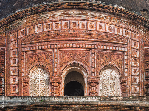 Scenic closeup view of ancient brick and terracotta pancharatna Govinda hindu temple upper floor, Puthia, Rajshahi, Bangladesh
