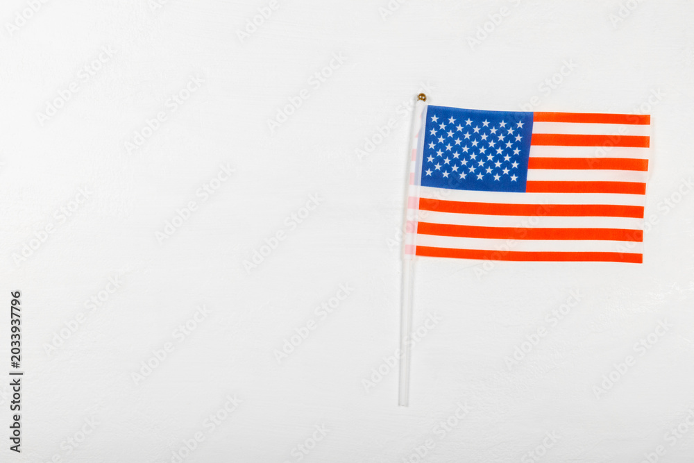 Fototapeta premium American flag on textured background. Memorial day, Independence Day and Veterans Day. American patriotism concept. Day of Remembrance and Honorary Banner. 4th of July celebration. Top view