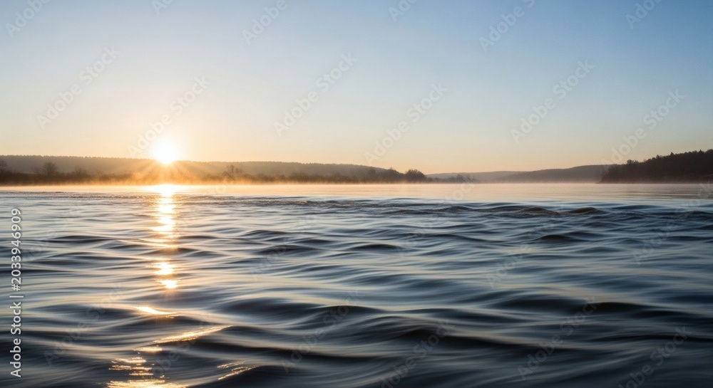 Obraz premium Calm Lake Water at Sunrise with Golden Reflection