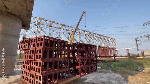 Construction Site with Steel Framework and Stacked Concrete Blocks of railway bridge