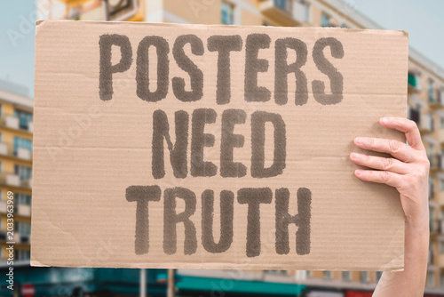 Fotografie "Posters Need Truth" Honest words calm divided crowds