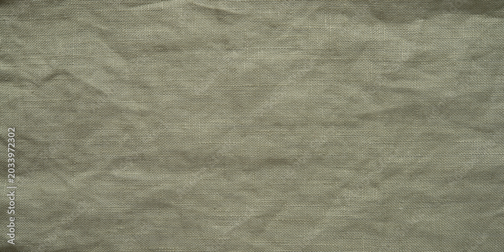 Fototapeta premium Olive green linen fabric texture, crumpled dark cotton cloth background with wrinkled pattern.
