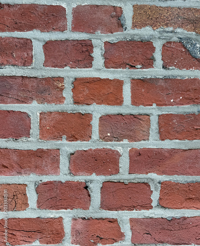 Alte rote Backsteinmauer mit verwitterter Struktur – Rustikaler Ziegelstein-Hintergrund 