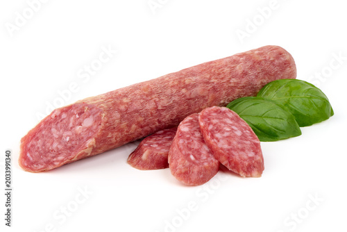 Dry Salami with Basil Leaves, isolated on white background