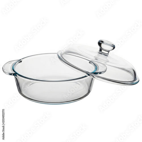 Clear glass casserole dish with a matching lid, side handles, and a round shape, isolated on a solid black background