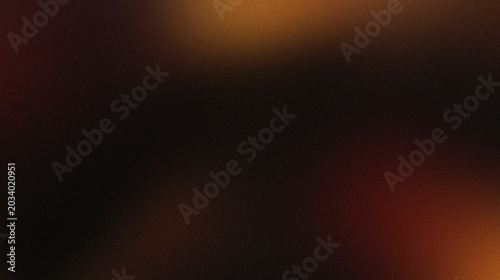 Foto Orange, brown, and black colors that resemble folds of fabric or sand dunes in low light