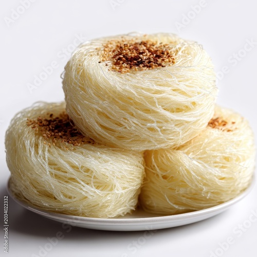 Stack of Vermicelli Noodles with Sesame Seeds on White Plate