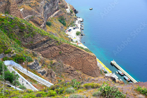 Fira cityscape with caldera and cloudy sky