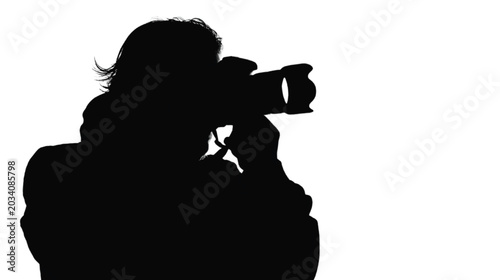 Photographer frames a shot through a camera lens, depicted as a bold black silhouette with visible hair texture and equipment contours that stand out sharply against the clean, expansive white.