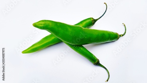 Quadro su tela green chili peppers, raw spicy green chili peppers isolated on white, fresh orga