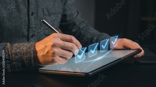 A person interacts with a digital checklist on a tablet at a desk.