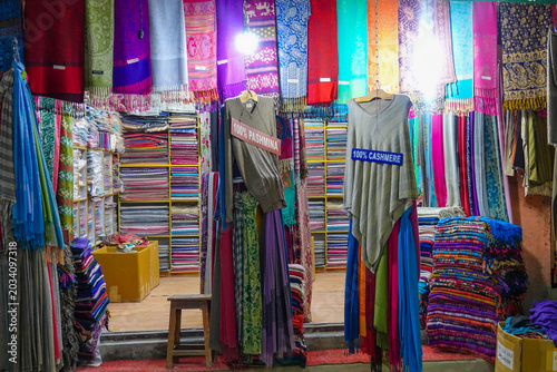 Bild auf Leinwand CLOSE UP: Beautiful colorful cashmere and pashmina scarf shop in Nepali streets