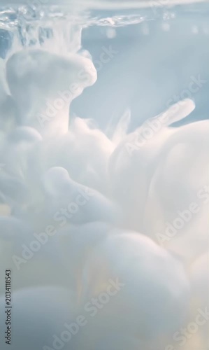 Calm milky fluid clouds blend inside transparent serum creating soft wellness cinematic gradients motion